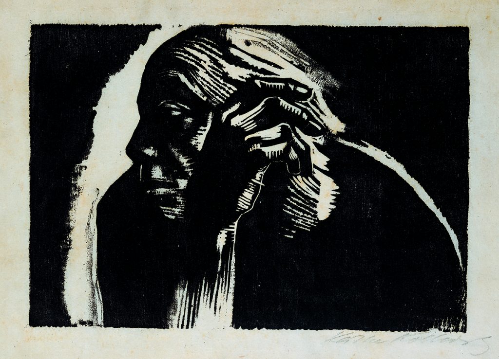 Selbstbildnis von Käthe Kollwitz im Profil. Bruststück. Der Kopf ist zur Seite gewandt. Ihre rechte Hand, mit der sie sich eben noch ihren Kopf abgestützt zu haben scheint, verharrt in der vertikalen Position. Unten rechts signiert: Käthe Kollwitz